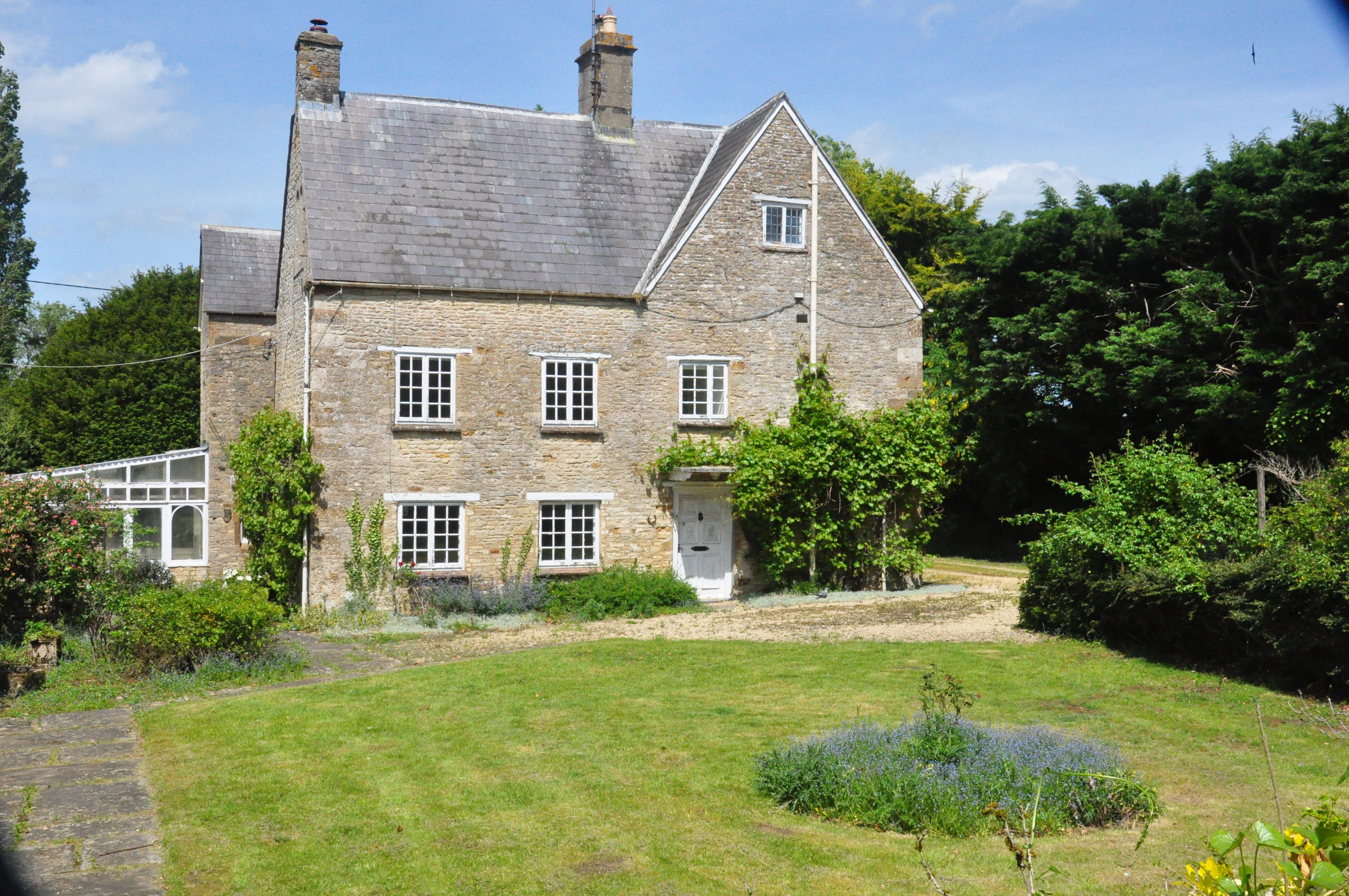 Old Manor Farm, Cottisford, limestone manor house in summer
